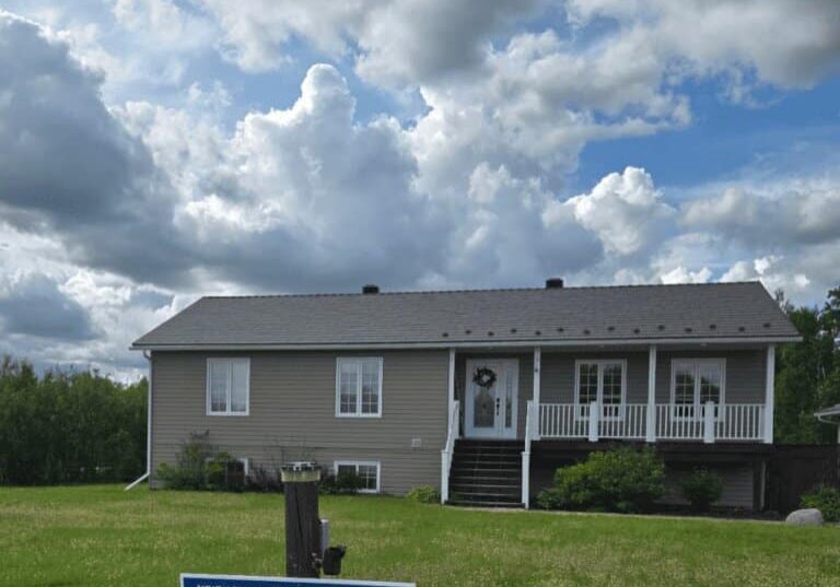 Grey steel roof installed by Roof Pros Plus on an Ontario home, featuring a Canadian-made metal roofing system designed for long-lasting durability and superior weather protection.