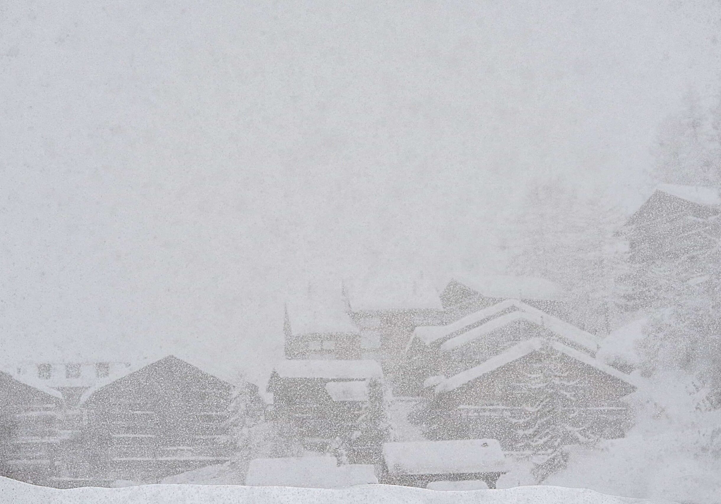snow storm view of homes in Ontario