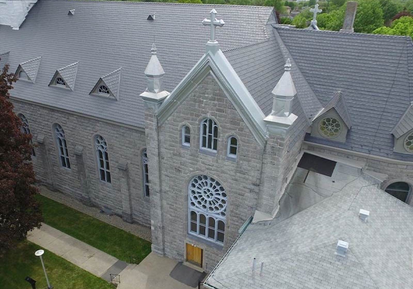 metal roof install in stone colour for a church