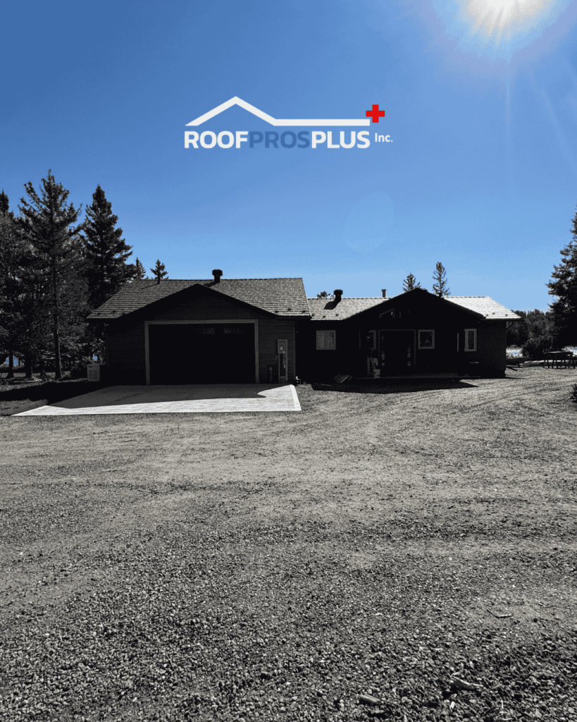 A residential house with a driveway, surrounded by trees under a clear blue sky. The logo of ROOFPROSPLUS Inc. is displayed at the top of the image.