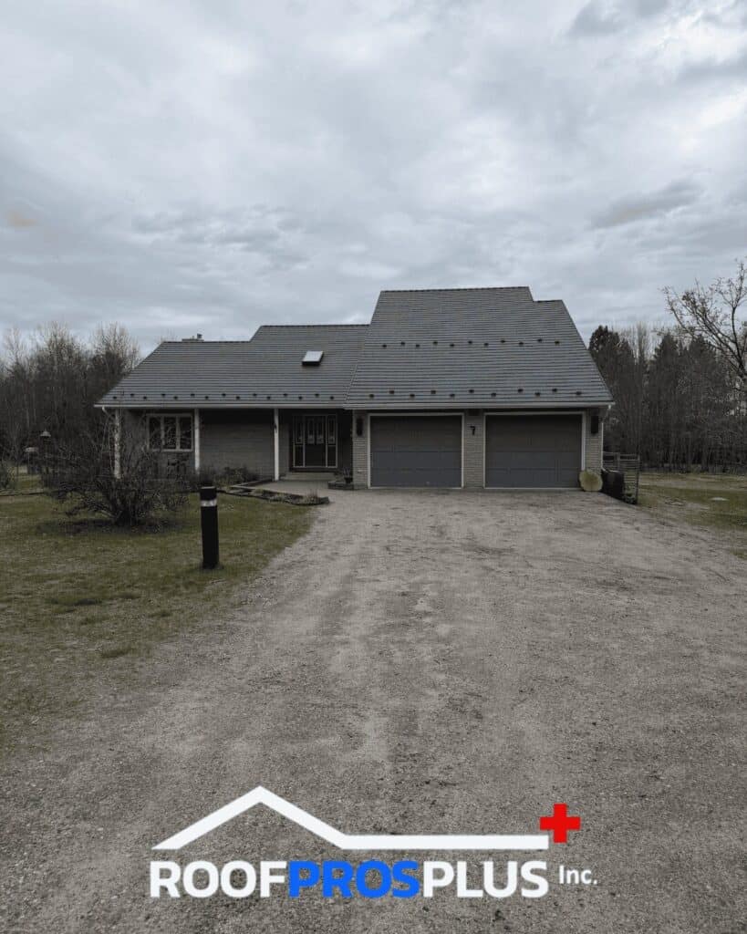 Residential grey steel roof installed by Roof Pros Plus on an Ontario home, featuring a durable metal roofing system designed for long-lasting protection and curb appeal.