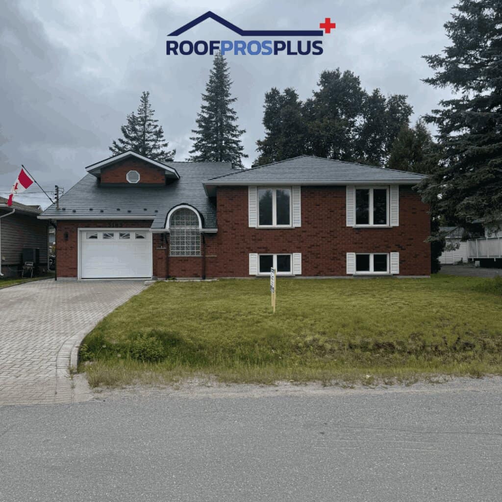 Residential home with a metal roof and brick exterior in a suburban neighborhood.