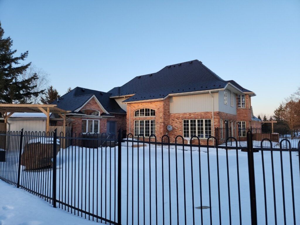 Stunning warm coloured brick home with new eclipse coloured metal roof