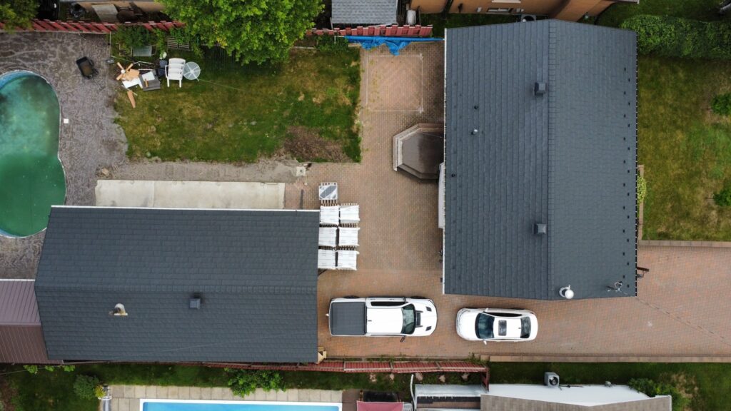 birds eye view of 2 residential homes with new metal roof instaled by Roof Pros Plus