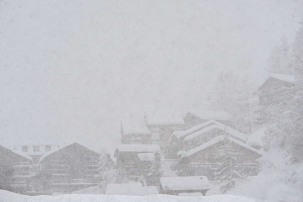 snow storm view of homes in Ontario